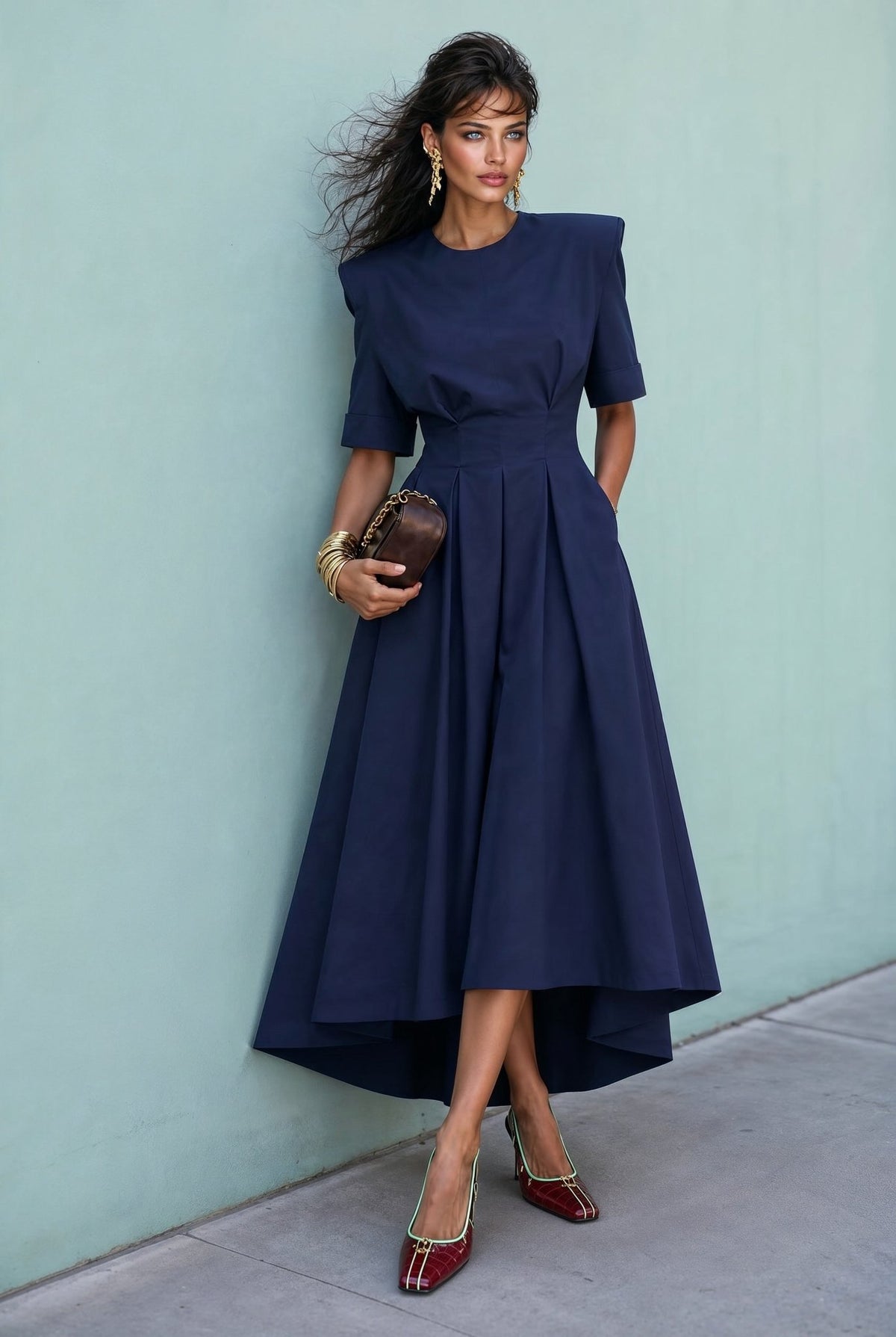 Audrey navy-blue midi dress with structured shoulders and pleated skirt, front view