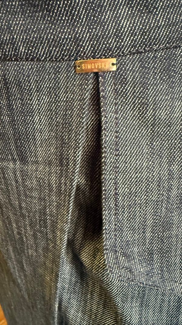 Close-up of Margot skirt’s blue denim wrap panel and front slit