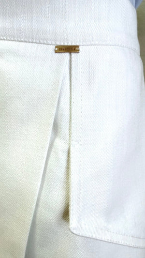 Close-up of Margot skirt’s white denim wrap panel and concealed front slit